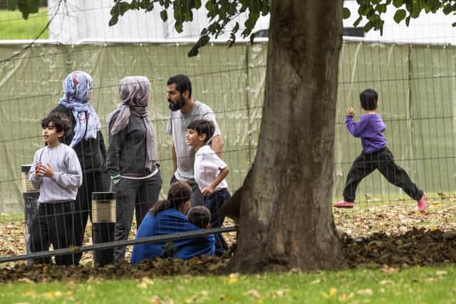 Families inside a migrant holding facility at Manston Airfield pictured earlier this month (Picture: Dan Kitwood/Getty Images)