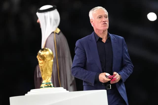 France manager Didier Deschamps walks past the World Cup trophy after the defeat by Argentina in the final.