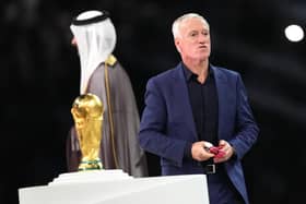 France manager Didier Deschamps walks past the World Cup trophy after the defeat by Argentina in the final.