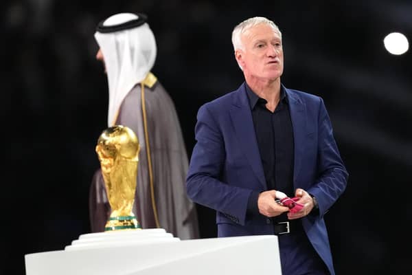 France manager Didier Deschamps walks past the World Cup trophy after the defeat by Argentina in the final.