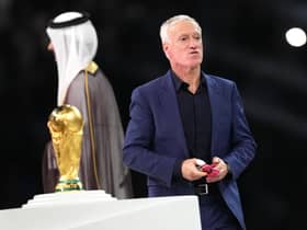 France manager Didier Deschamps walks past the World Cup trophy after the defeat by Argentina in the final.