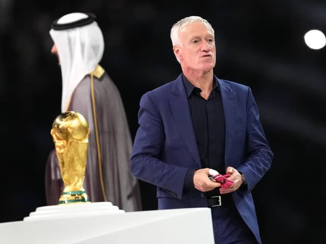 France manager Didier Deschamps walks past the World Cup trophy after the defeat by Argentina in the final.