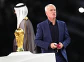 France manager Didier Deschamps walks past the World Cup trophy after the defeat by Argentina in the final.