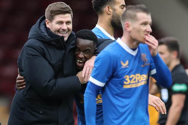 Rangers manager Steven Gerrard hugs Fashion Sakala in celebration after the striker scored a hat-trick in the 6-1 win over Motherwell at Fir Park on Sunday. (Photo by Ian MacNicol/Getty Images)