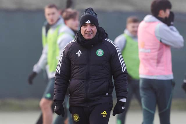 Celtic manager Brendan Rodgers braves the cold during training at Lennoxtown.