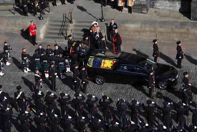 Royal guards wait to carry Queen Elizabeth II's coffin as it arrives at St Giles' Cathedral, Edinburgh for a Service of Prayer and Reflection for her life. Picture date: Monday September 12, 2022.
