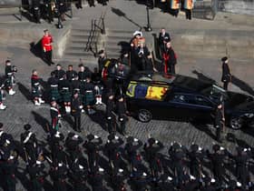 Royal guards wait to carry Queen Elizabeth II's coffin as it arrives at St Giles' Cathedral, Edinburgh for a Service of Prayer and Reflection for her life. Picture date: Monday September 12, 2022.