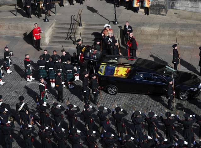 Royal guards wait to carry Queen Elizabeth II's coffin as it arrives at St Giles' Cathedral, Edinburgh for a Service of Prayer and Reflection for her life. Picture date: Monday September 12, 2022.