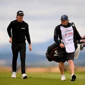 Sean Crocker walks with his caddie during the third round of the Hero Open at Fairmont St Andrews. Picture: Ross Kinnaird/Getty Images.