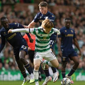 Celtic's Kyogo Furuhashi fends off two of Dundee's young midfielders Malachi Boeteng (left) and Ryan Howley, 20 and 19-years-old respectively.  (Photo by Craig Foy / SNS Group)