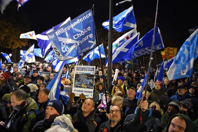Pro-Scottish independence supporters wave Saltire flags during a rally outside parliament in Edinburgh on November 23, 2022 after the UK Supreme Court rejected Scottish independence vote plans.