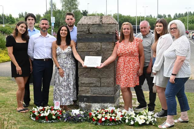 Members of David Scott's family with the new plaque beside Newton station: Holly Scott, Lewis Buchan, Stuart Scott (brother), Margaret Scott, Kyle Scott, Lynda Scott (sister) Robert McCaughley, Keirra Scott, Lorraine King (sister). Picture: John Devlin