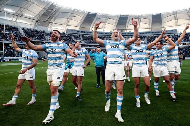 Argentina celebrate after their victory over Scotland in the series-deciding third Test at Madre de Ciudades Stadium. (Photo by Pablo Gasparini/AFP via Getty Images)