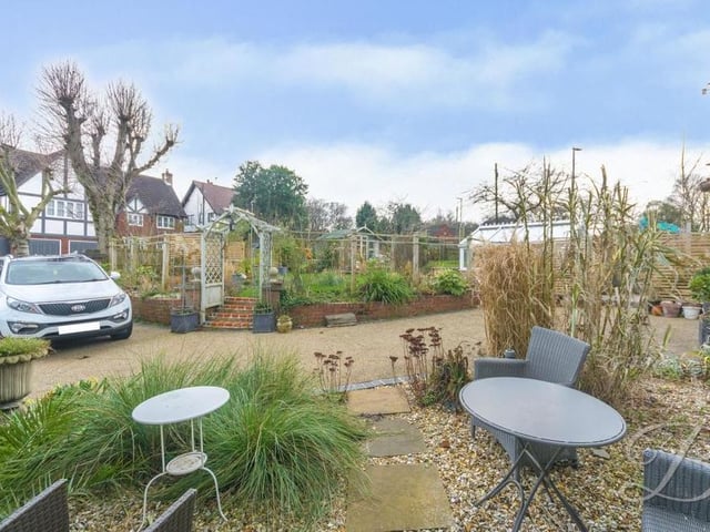 One of the patio areas, nestled among the mature shrubs.