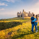 A couple survey Slains Castle in Aberdeenshire. Picture: VisitScotland