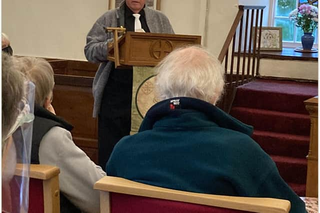 Dave, a boat builder and joiner, takes to the lectern for the first time at Fogo Parish Church. PIC: Contributed.