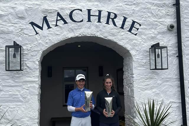 Sam Mukherjee and Summer Elliot show off their respective trophies at The Machrie.