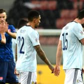 Scotland's Scott McKenna (right) and Liam Palmer appear dejected after the final whistle.