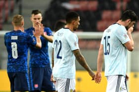 Scotland's Scott McKenna (right) and Liam Palmer appear dejected after the final whistle.