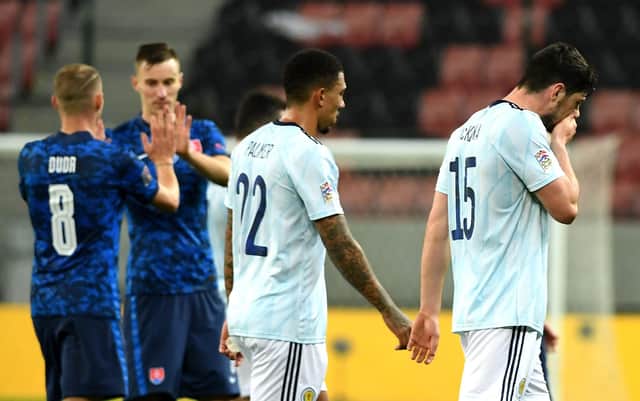 Scotland's Scott McKenna (right) and Liam Palmer appear dejected after the final whistle.