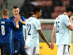 Scotland's Scott McKenna (right) and Liam Palmer appear dejected after the final whistle.