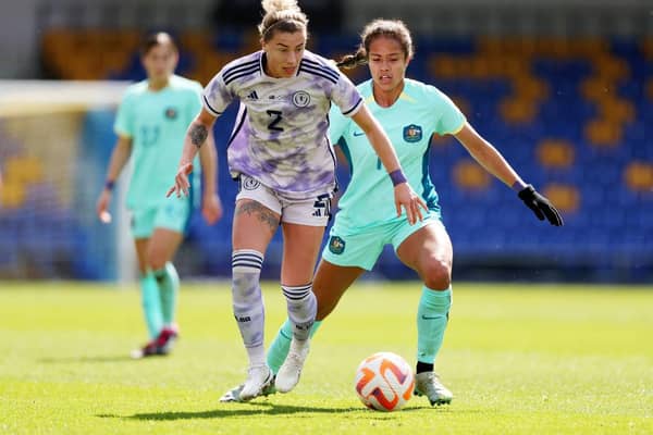 Nicola Docherty of Scotland battles for possession with Mary Fowler of Australia during the Women's International Friendly match between Australia and Scotland at The Cherry Red Records Stadium on April 07, 2023 in Wimbledon, England. (Photo by Julian Finney/Getty Images)
