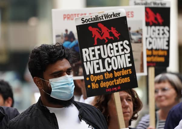 Stand Up to Racism and the Afghan Human Rights Foundation stage a protest outside the Home Office in Westminster, central London.
