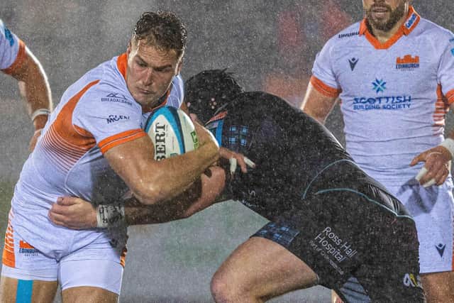 Edinburgh's Duhan van der Merwe is tackled during the defeat by Glasgow Warriors at Scotstoun.  (Photo by Ross Parker / SNS Group)