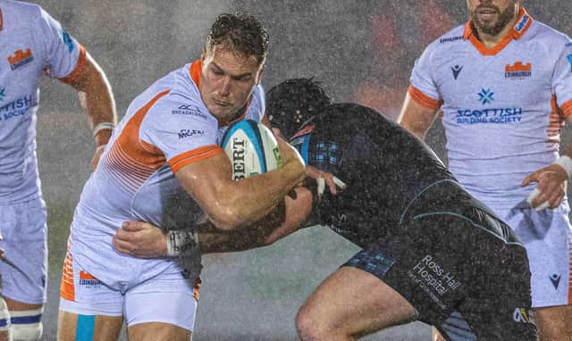 Edinburgh's Duhan van der Merwe is tackled during the defeat by Glasgow Warriors at Scotstoun.  (Photo by Ross Parker / SNS Group)