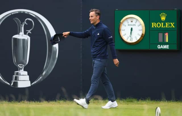 Host club member Matthew Jordan acknowledges fans on the 1st tee on day ine of The 151st Open at Royal Liverpool. Picture: Andrew Redington/Getty Images.