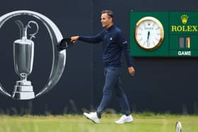 Host club member Matthew Jordan acknowledges fans on the 1st tee on day ine of The 151st Open at Royal Liverpool. Picture: Andrew Redington/Getty Images.