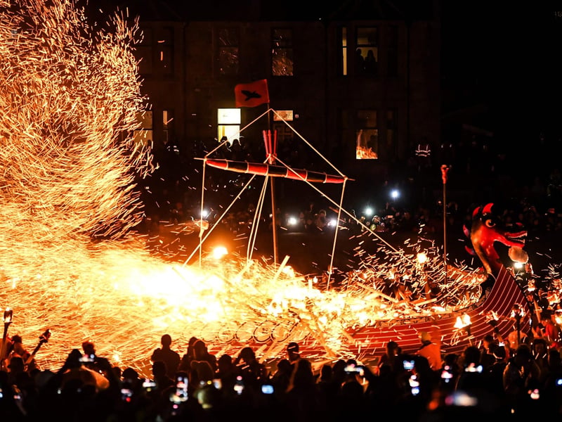 The Lerwick Up Helly Aa Committee last year decided to relax the long-standing custom of only allowing males to take part in the procession after members discussed how to take the event forward following a two-year absence due to the Covid-19 pandemic.
Photo by Andy Buchanan / AFP