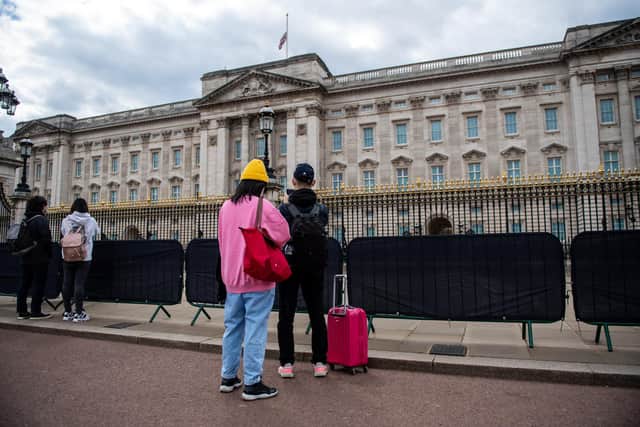 Members of the public visit Buckingham Palace as tributes to Prince Philip