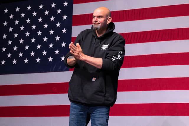President Joe Biden's party picked up a first seat in the upper chamber of Congress on Tuesday as Democrat John Fetterman defeated celebrity doctor Mehmet Oz in Pennsylvania, media projections showed.