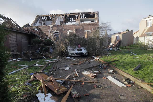 Tornado-like storms that tore through northern France sheared off part of a church roof, felled trees and power lines and left scores of people without a safe place to live, authorities said Monday. One person suffered light injuries in the storms Sunday and some 150 people were evacuated, according to the regional administration for the Pas-de-Calais region.(AP Photo/Michel Spingler)