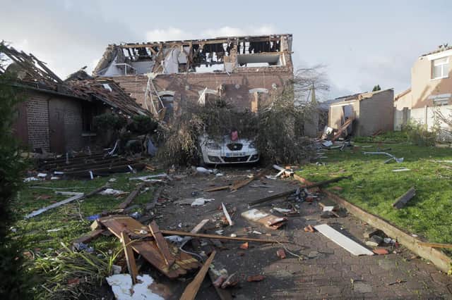 Tornado-like storms that tore through northern France sheared off part of a church roof, felled trees and power lines and left scores of people without a safe place to live, authorities said Monday. One person suffered light injuries in the storms Sunday and some 150 people were evacuated, according to the regional administration for the Pas-de-Calais region.(AP Photo/Michel Spingler)