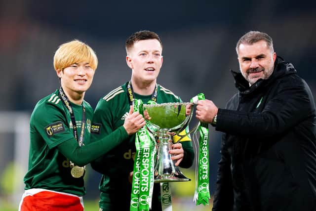 Celtic manager Ange Postecoglou (right), Kyogo Furuhashi (left) and Callum McGregor celebrate with the trophy after winning the Premier Sports Cup Final at Hampden Park, Glasgow. (Picture: Jane Barlow/PA Wire).