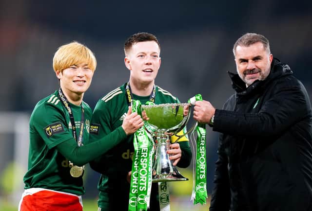 Celtic manager Ange Postecoglou (right), Kyogo Furuhashi (left) and Callum McGregor celebrate with the trophy after winning the Premier Sports Cup Final at Hampden Park, Glasgow. (Picture: Jane Barlow/PA Wire).