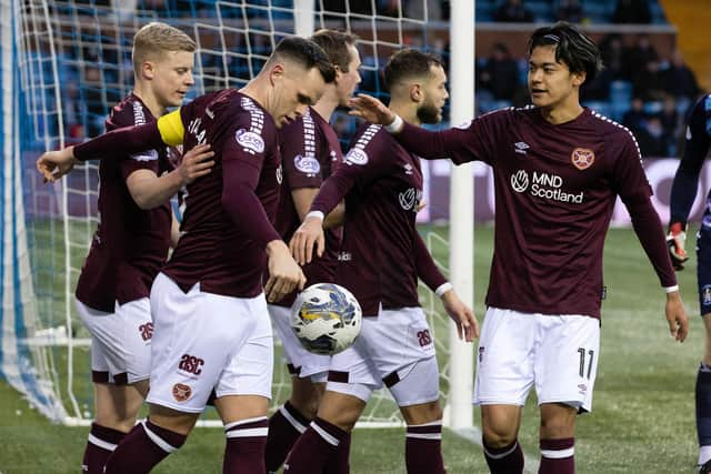 Hearts' Lawrence Shankland celebrates with Alex Cochrane (left), Jorge Grant (second from right) and Yutaro Oda (right) as Kilmarnock's Will Dennis scores an own goal.