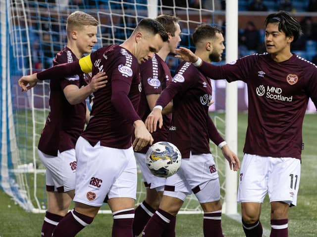 Hearts' Lawrence Shankland celebrates with Alex Cochrane (left), Jorge Grant (second from right) and Yutaro Oda (right) as Kilmarnock's Will Dennis scores an own goal.