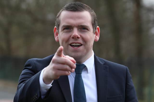 Scottish Conservative Leader Douglas Ross outside New Stobhill Hospital in Springburn, north Glasgow, for the announcement of the party's NHS spending pledge and the unveiling of a banner on the vaccine rollout programme, during campaigning for the Scottish Parliamentary election. Picture date: Thursday April 1, 2021.
