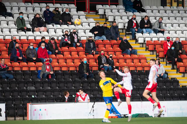 Fans watch on during the Scottish Championship play-off final first leg tie between Airdrie and Morton at Penny Cars Stadium.