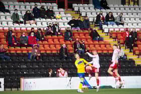 Fans watch on during the Scottish Championship play-off final first leg tie between Airdrie and Morton at Penny Cars Stadium.
