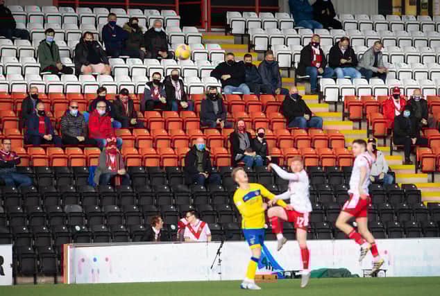 Fans watch on during the Scottish Championship play-off final first leg tie between Airdrie and Morton at Penny Cars Stadium.