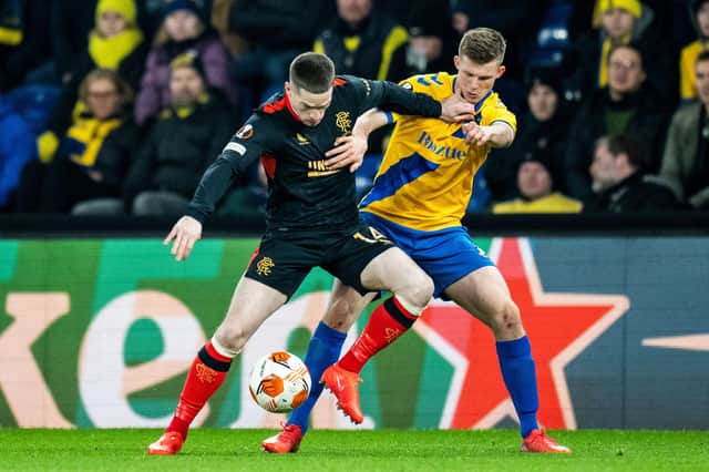 Rangers winger Ryan Kent holds off a challenge from Brondby's Morten Frendrup during his comeback from injury for the Scottish champions on Thursday. (Photo by MARTIN SYLVEST/Ritzau Scanpix/AFP via Getty Images)
