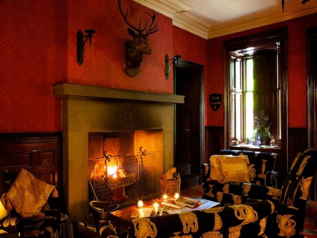 The Tulloch Castle Hotel offers guests a regal stay in a 12th-century-castle set in the beautiful Highlands of Scotland, five minutes from Dingwall. There are a number of spectres said to haunt its atmospheric corridor but the most famous is the Green Lady, after whom the hotel bar is named. She is seen in a long silk dress, and is said to fill those who spot her with great sorrow as they hear her whisper "why?". Investigators have seen unexplained balls of light and orbs, felt icy cold patches of air, and heard clicks, bangs and thuds.