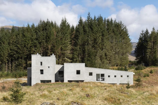 Denizen Works’ clients set out to create a home for themselves and their large family: a place that would reflect their personalities, provide a lasting legacy for the family, and do justice to its setting within a stunning landscape overlooking Loch Awe. The design draws upon Scotland’s architectural heritage as well as the sculpture of Eduardo Chillida which, like the house, evokes a sense of carved solid mass which is well-suited to the exposed site and harsh weather. Quirky touches include cladding created with recycled TV screens to create a contemporary take on traditional Scottish harling, and a bathroom with two copper baths side by side, looking out upon the rocky landscape.