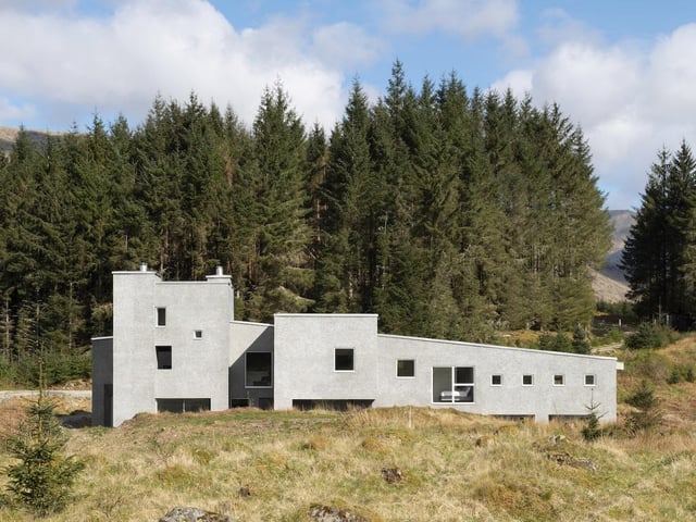 Denizen Works’ clients set out to create a home for themselves and their large family: a place that would reflect their personalities, provide a lasting legacy for the family, and do justice to its setting within a stunning landscape overlooking Loch Awe. The design draws upon Scotland’s architectural heritage as well as the sculpture of Eduardo Chillida which, like the house, evokes a sense of carved solid mass which is well-suited to the exposed site and harsh weather. Quirky touches include cladding created with recycled TV screens to create a contemporary take on traditional Scottish harling, and a bathroom with two copper baths side by side, looking out upon the rocky landscape.