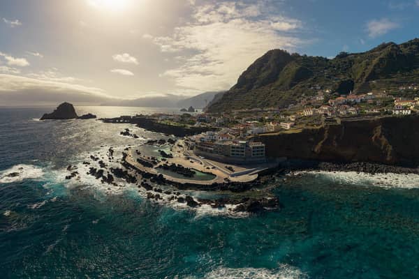 The stunning Porto Moniz tidal swimming pool in the foreground, which has been voted one of the best of its kind in the world. Picture: DigitalTravelCouple.