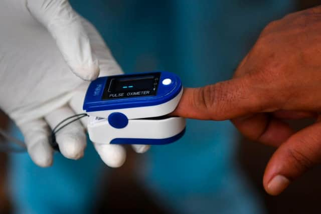 Pulse oximeters are currently being rolled out by the NHS to some Covid-19 patients across the UK (Getty Images)